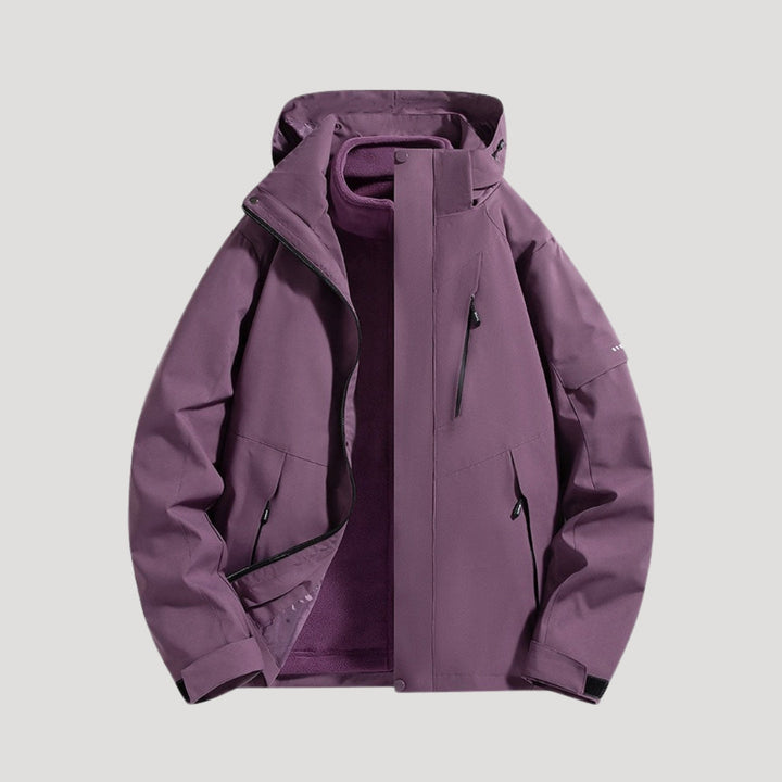 Side view of womens rain jacket with adjustable hood and taped seams