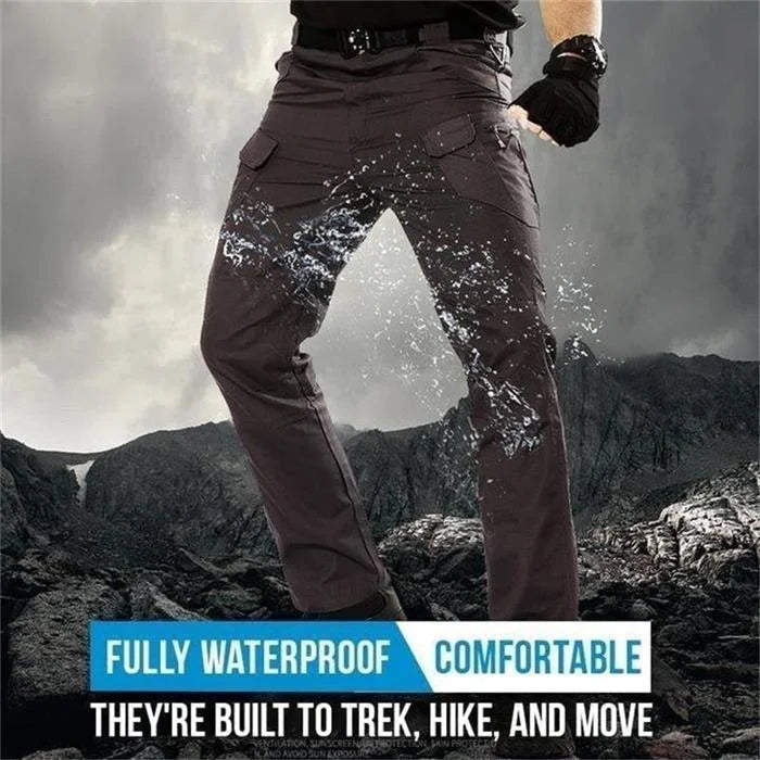 Water-resistant fabric demonstration on grey mens outdoor cargo pants