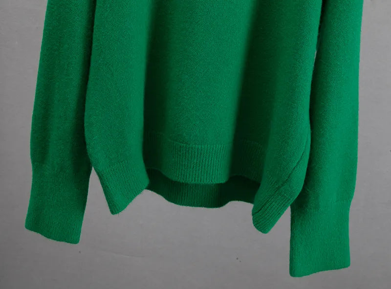 Detailed macro view of the cozy yarn pattern on the green knitwear