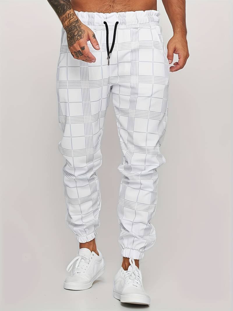 Close-up view of the breathable fabric and plaid pattern on men's casual checked joggers.