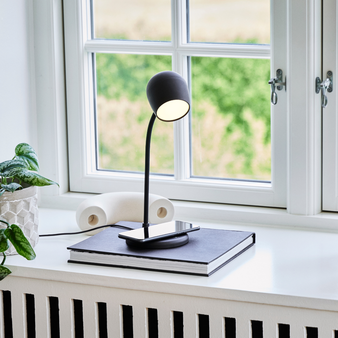 Smart lighting desk lamp showing adjustable brightness levels for studying