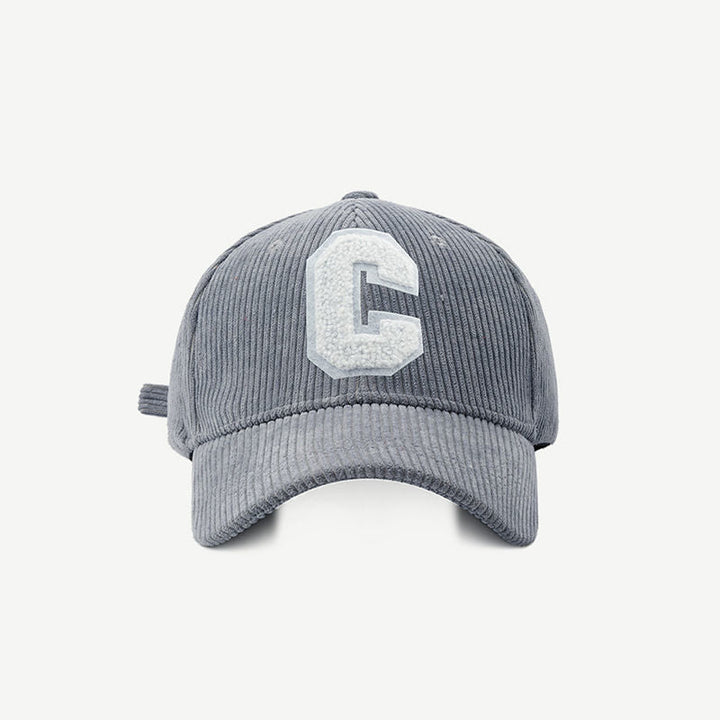 Grey embroidered letter patch cap shown from the front against a plain background
