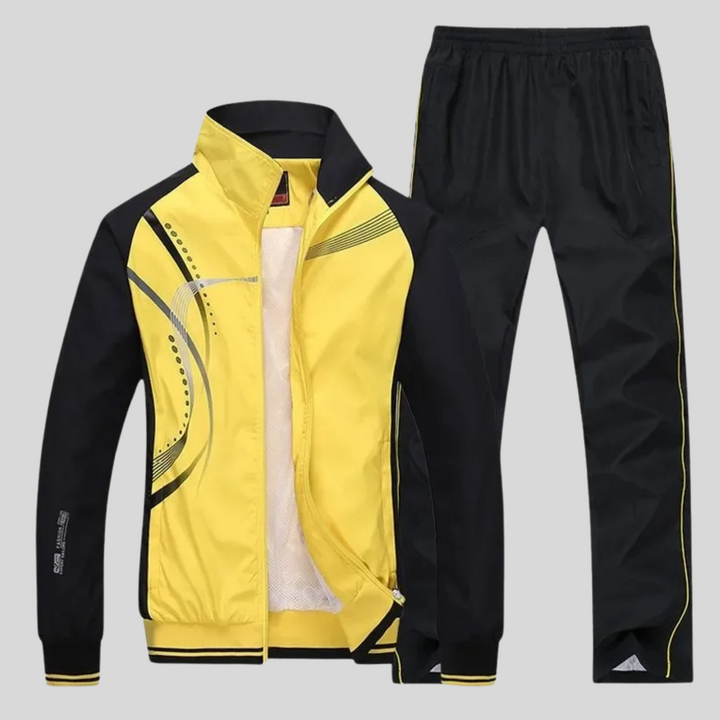 Mens tracksuit lifestyle shot outdoors during athletic training