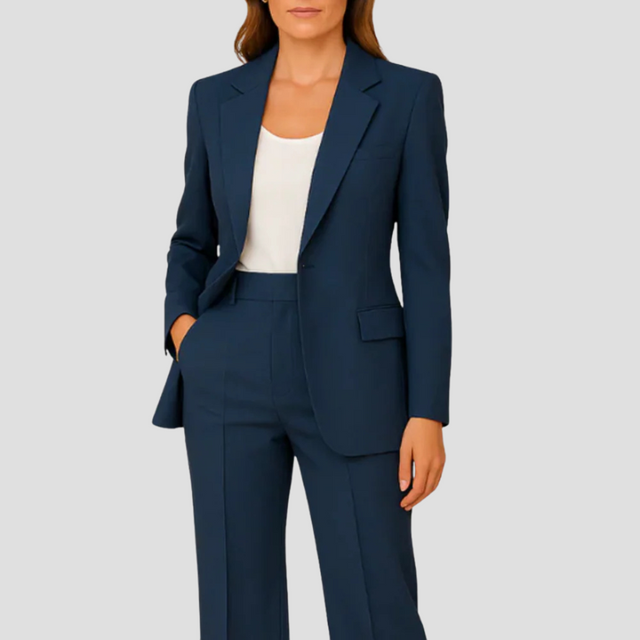 Model wearing navy blue women's tailored two-piece blazer suit set