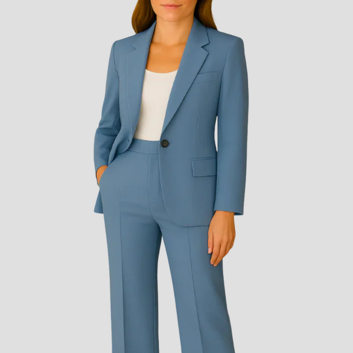 Close-up of the structured lapel and button detail on a formal matching blazer set