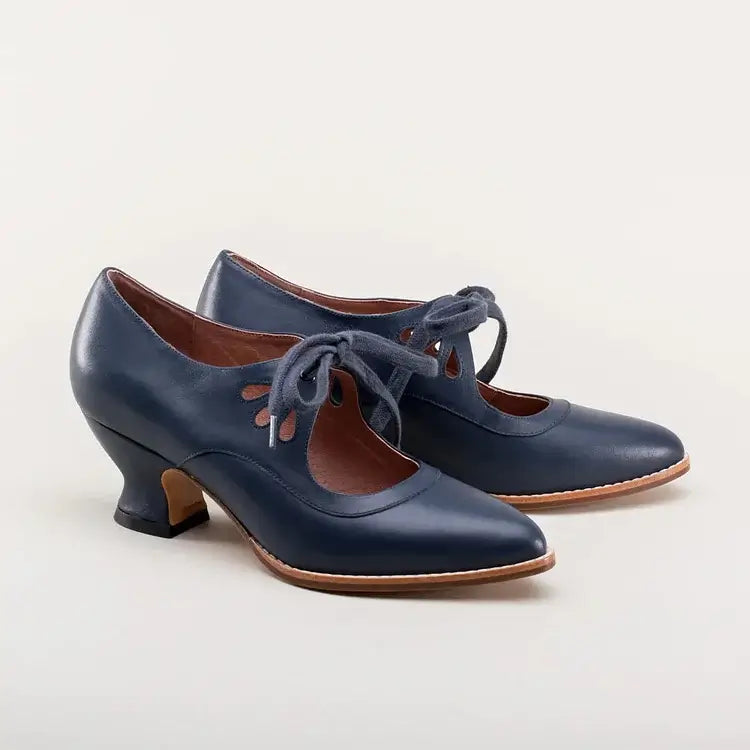 Close-up of premium material and fine stitching on elegant women's dress shoes.