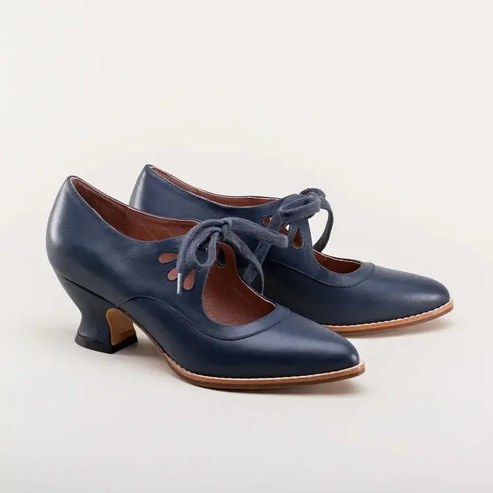 Close-up of premium material and fine stitching on elegant women's dress shoes.