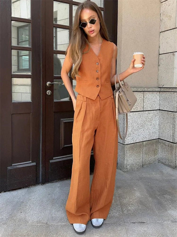 Back view of the chic women two piece outfit with tailored vest