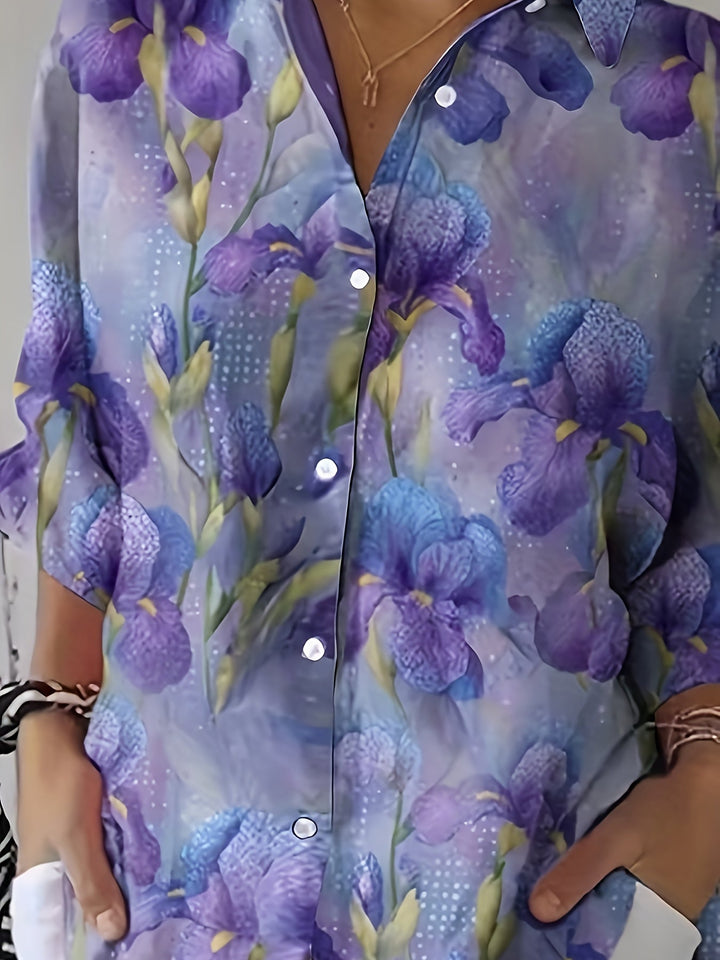 Close-up view of the button placket and floral print on the blouse