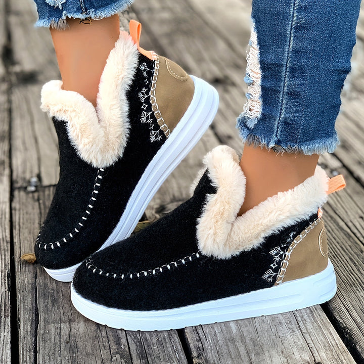 Women's warm winter slippers featuring a cozy plush lining for indoor comfort