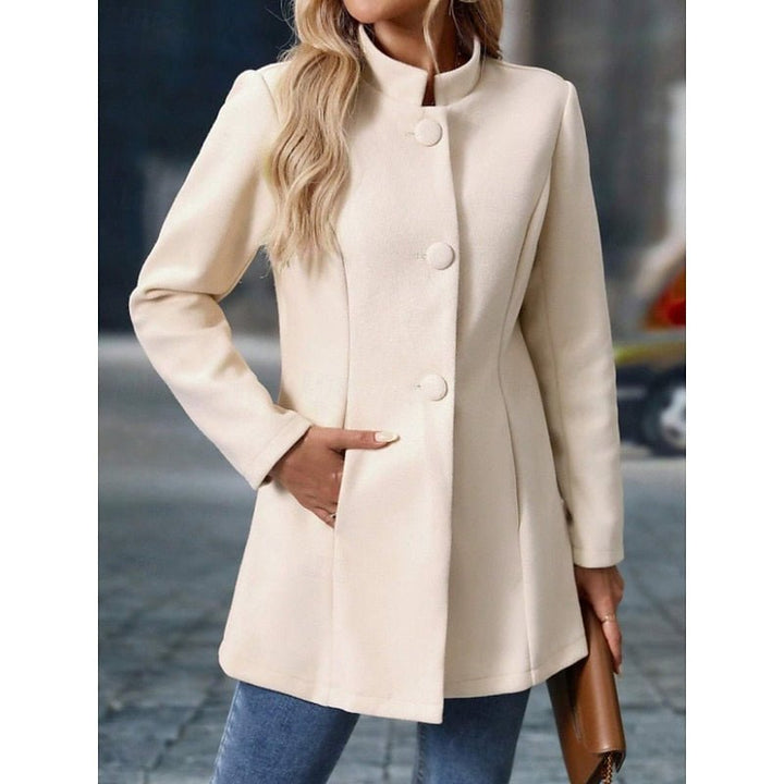 Side profile showing the tailored fit and stand collar of the trench coat