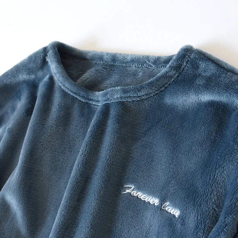 Men's cozy sleepwear set hanging neatly on a wooden hanger