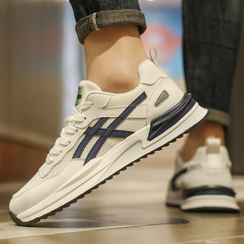 Close-up side profile of a man wearing blue and white breathable mesh running shoes