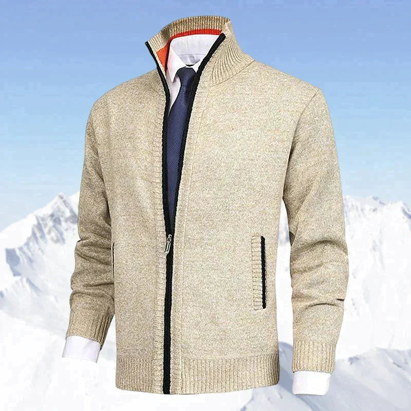 Beige men's zip cardigan featured in front of an outdoor winter mountain landscape
