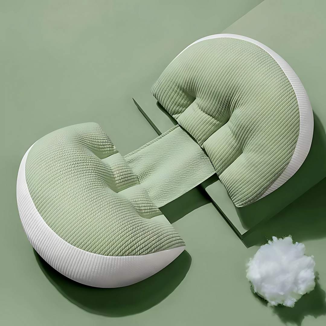 Sage green and white maternity butterfly pillow displayed on a green background with soft filling material