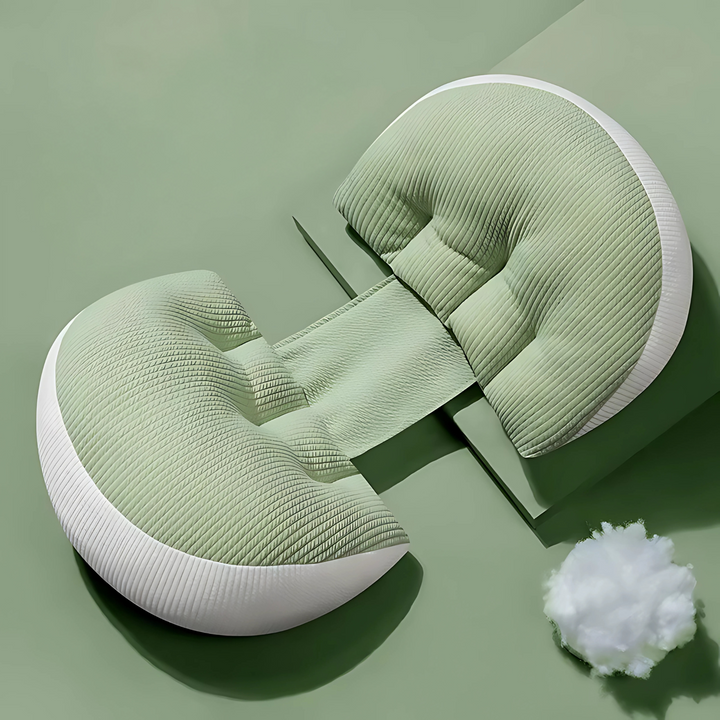 Sage green and white maternity butterfly pillow displayed on a green background with soft filling material
