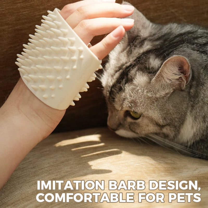 White silicone pet grooming hand comb worn on hand next to a cat