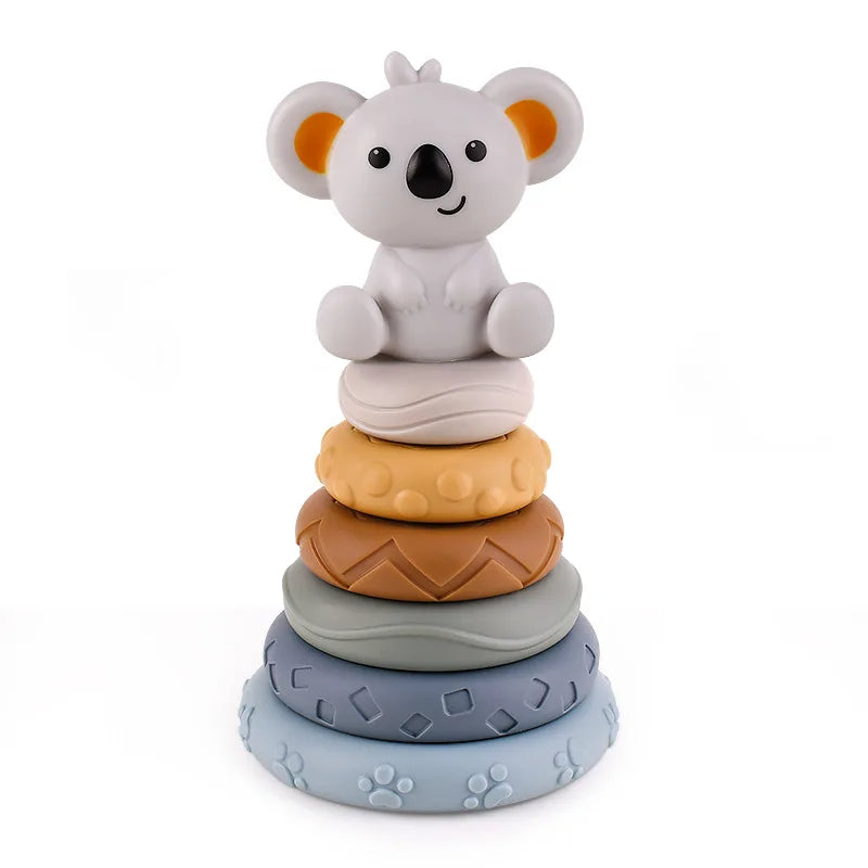 Silicone teething rings stacked in a tower topped with a friendly koala toy