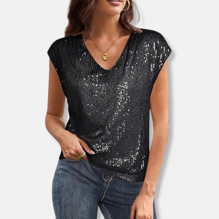 Woman wearing black sparkly sequin V-neck top with relaxed fit
