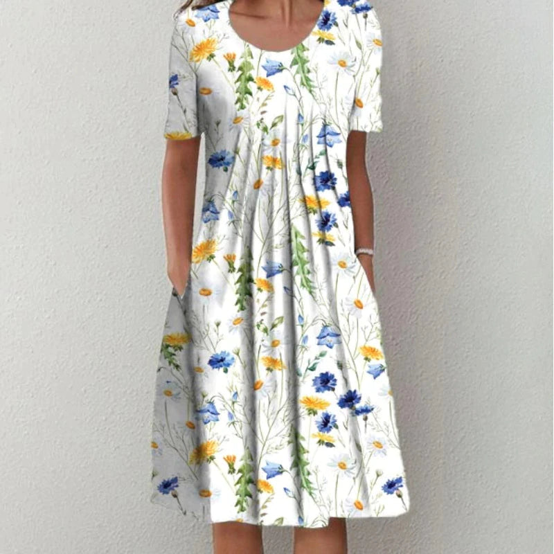 Woman wearing a white floral print midi dress with short sleeves and pockets