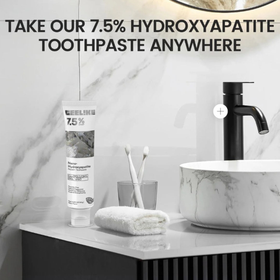 Close-up of the hydroxyapatite toothpaste tube next to bathroom sink setup