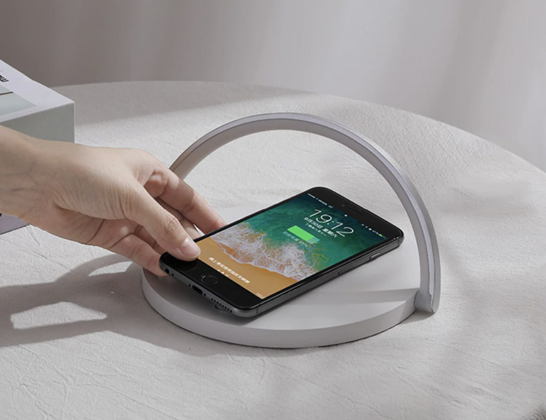 Universal 3-in-1 night lamp and Qi wireless charger showcasing smartphone charging stand