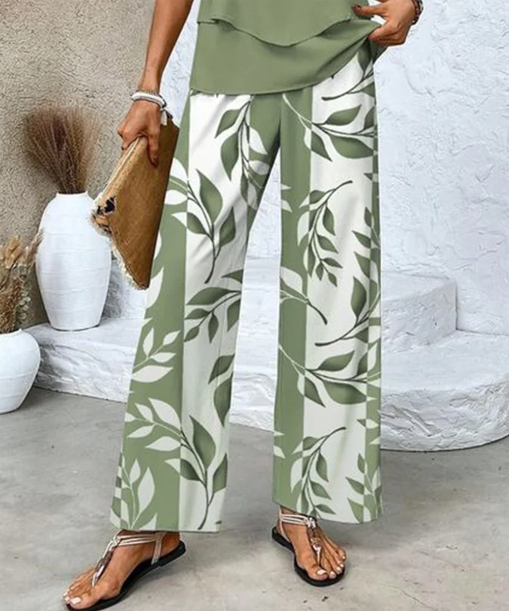 Flat lay of the women's casual chic two-piece outfit with leaf print