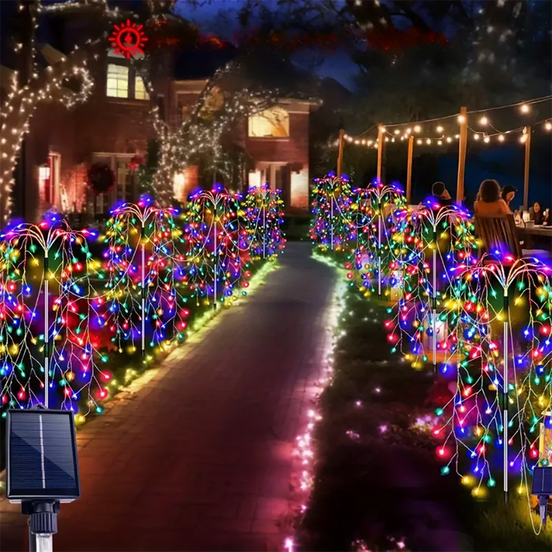 Pathway illuminated by vibrant multi-colored solar firework lights leading toward a house