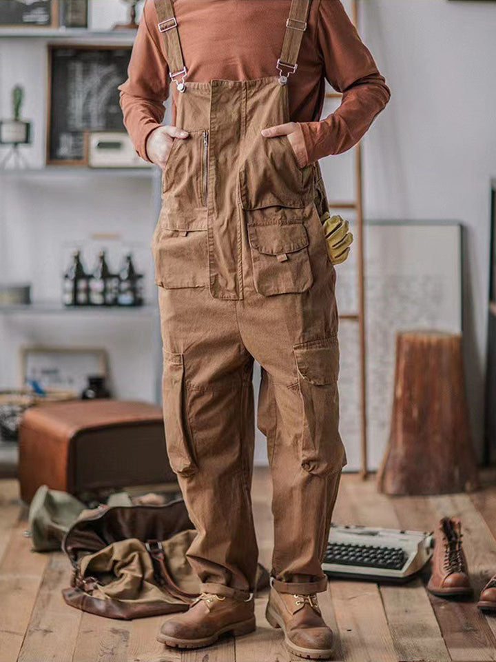 Adjustable shoulder straps and buckle detail on men's workwear overalls
