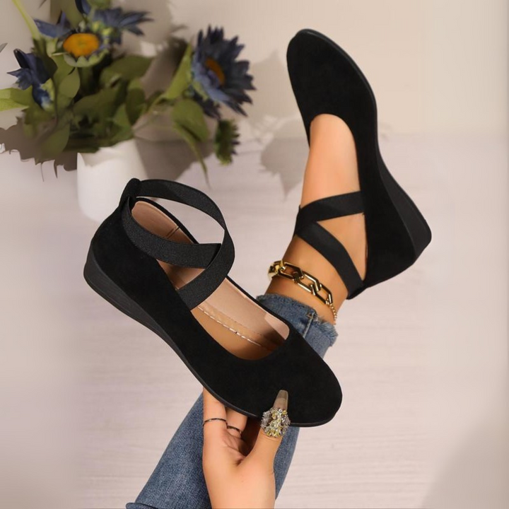 Black women's closed wedge ballet flats with elastic straps