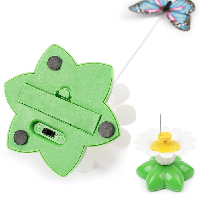 Bottom view of the green flower base showing battery compartment and suction feet