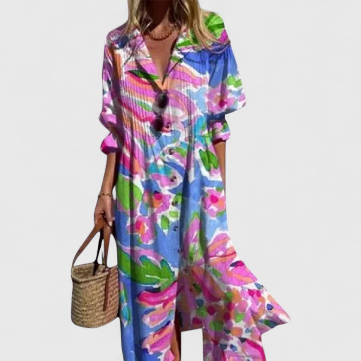 Woman wearing vibrant floral and blue maxi shirt dress