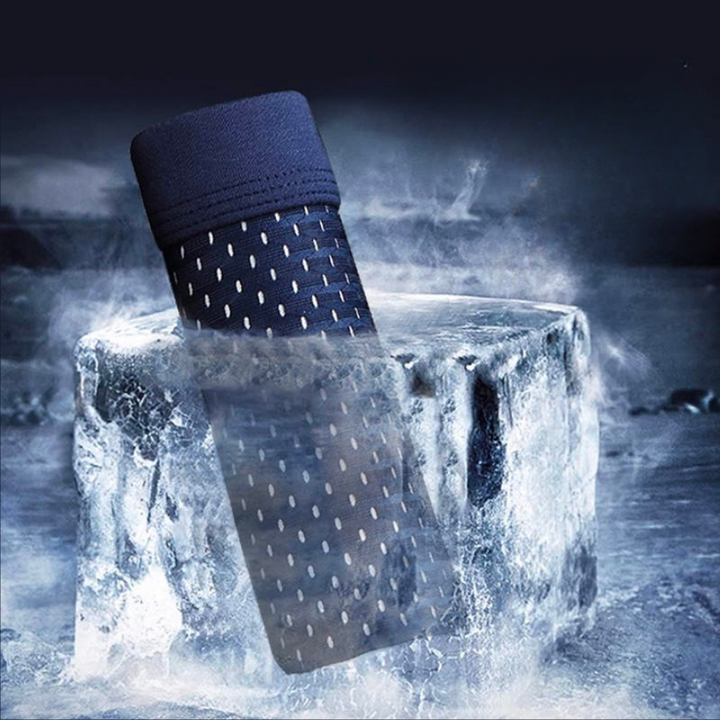 Blue men's boxer shorts displayed upright partially submerged in ice