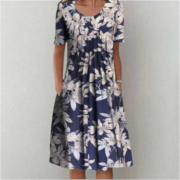 Breathable short sleeve midi dress showcasing a vibrant floral pattern for women.