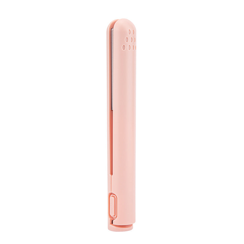 Portable hair styler safety cap on, showing compact size for luggage packing