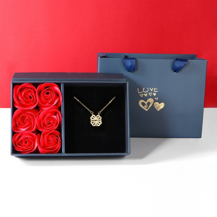 Gold diamond-look necklace presented in a gift box with red rose soaps
