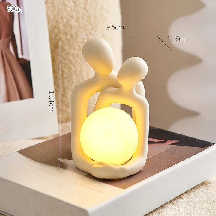 Side view of ceramic couple sculpture mood light with dimensional height measurements