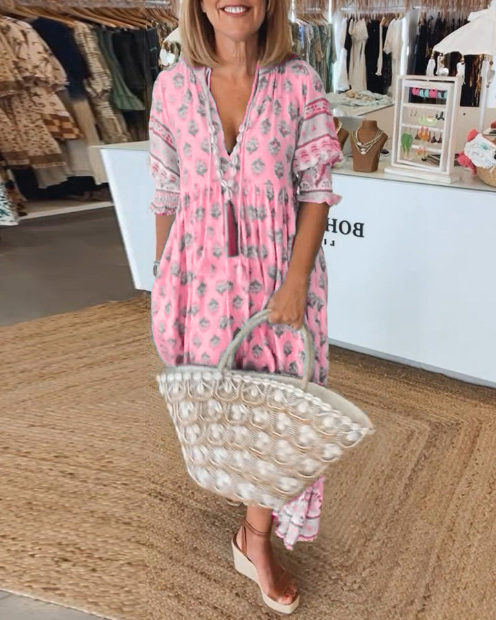Lifestyle shot of a woman wearing the casual V-neck printed dress