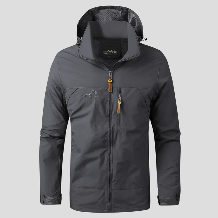 Grey men's hiking jacket laid flat to display its full waterproof and windproof design.