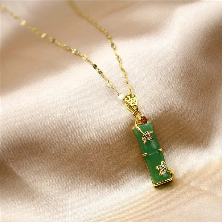 Minimalist green jade gemstone pendant necklace on a delicate chain, ideal as a spiritual gift for her