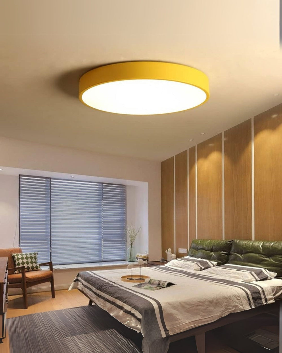 Designer style flat disc ceiling light illuminating a cozy corner