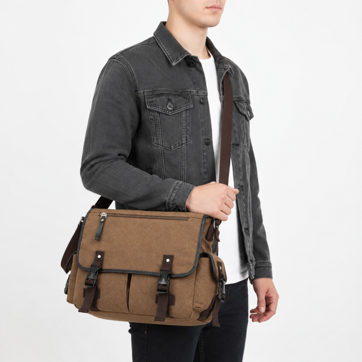 Open view of the vintage canvas laptop bag displaying inner compartments and secure zipper pocket.