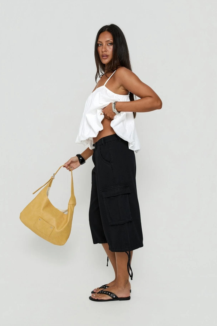 Close-up of cargo pocket detail on women's utility streetwear shorts