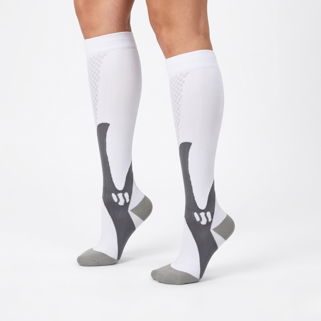 Close-up of model wearing white and grey athletic compression socks