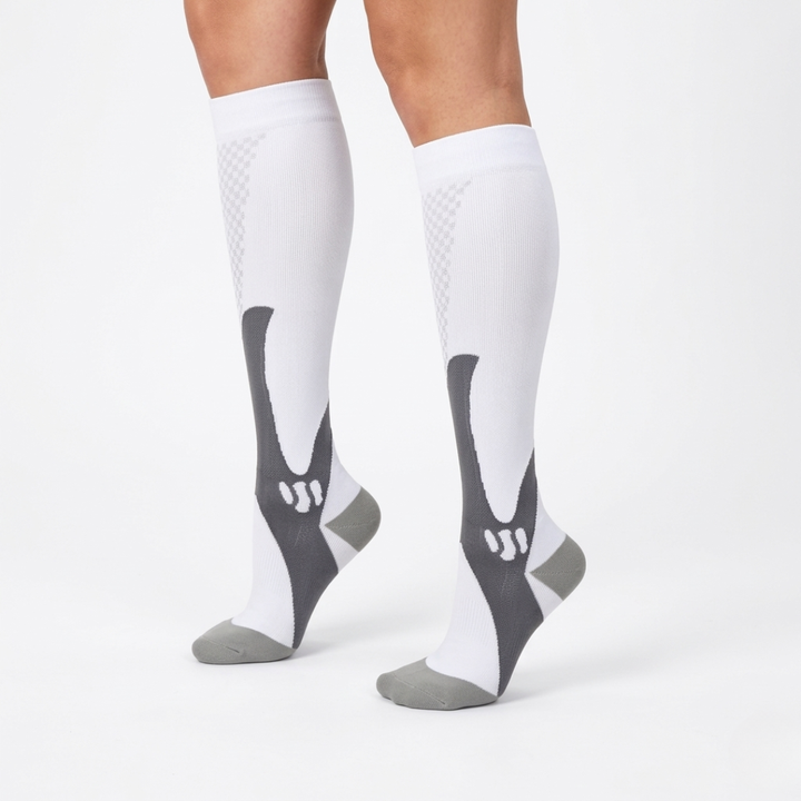 Close-up of model wearing white and grey athletic compression socks