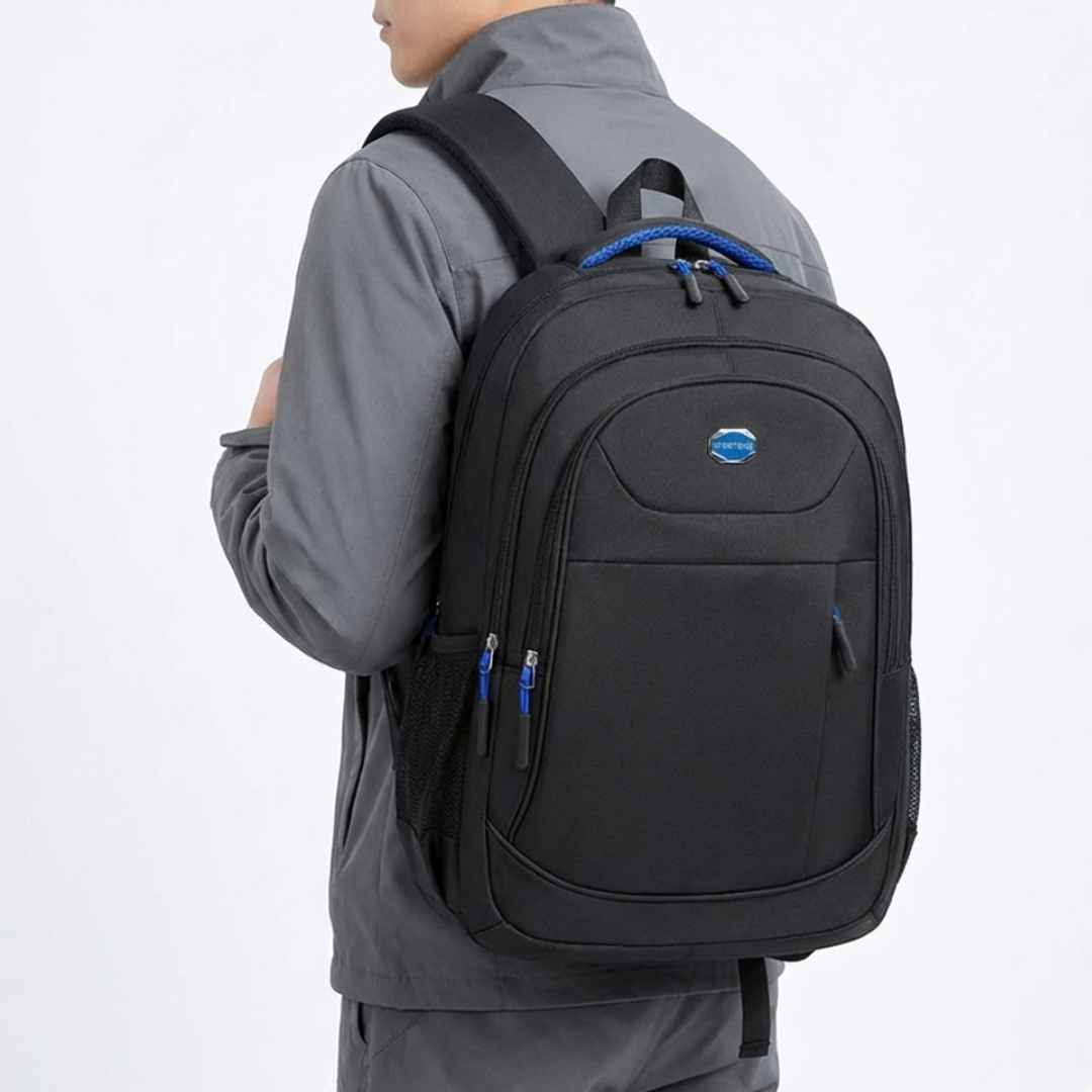 Spacious main compartment of the laptop backpack organized for books, folders, and devices.