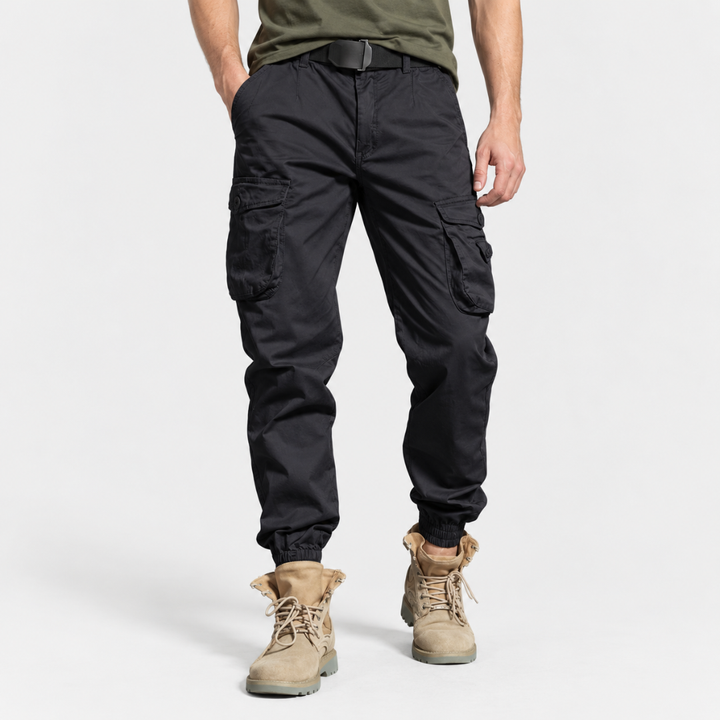 Close-up view of sturdy belt loops and secure button closure on cargo pants
