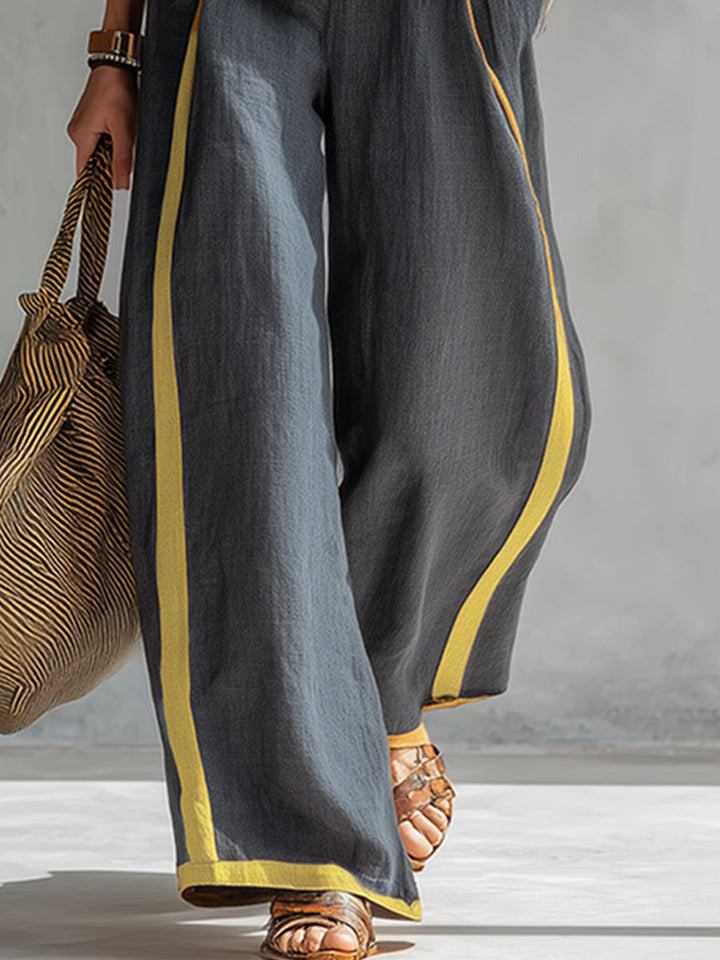 Elegant womens two piece outfit featuring a sleeveless top and wide leg trousers