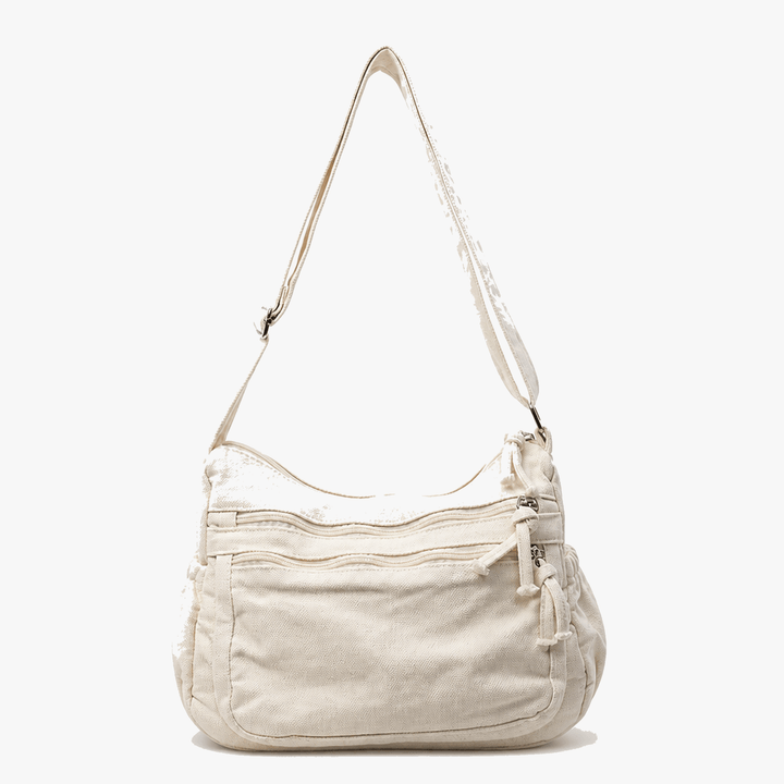 Close-up of sturdy straps on women's everyday canvas tote bag