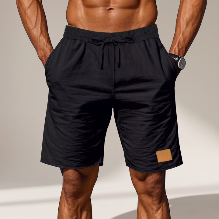 Side profile of mens summer wear shorts showing relaxed fit and pocket detail
